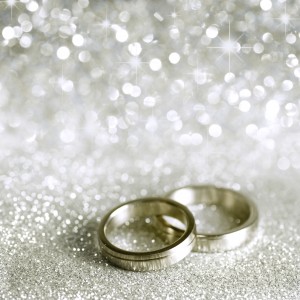 Beautiful silver background with wedding rings and stars